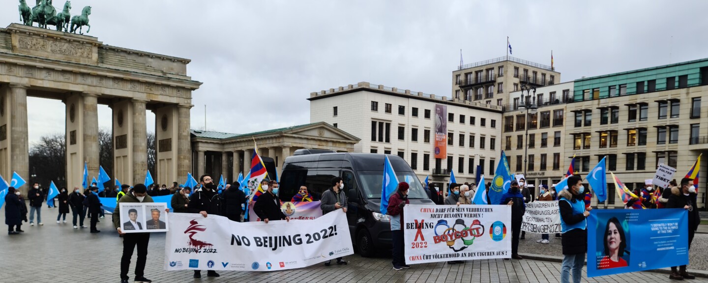 this photo shows protesters in Berlin, protesting against China's policies in Xinjiang